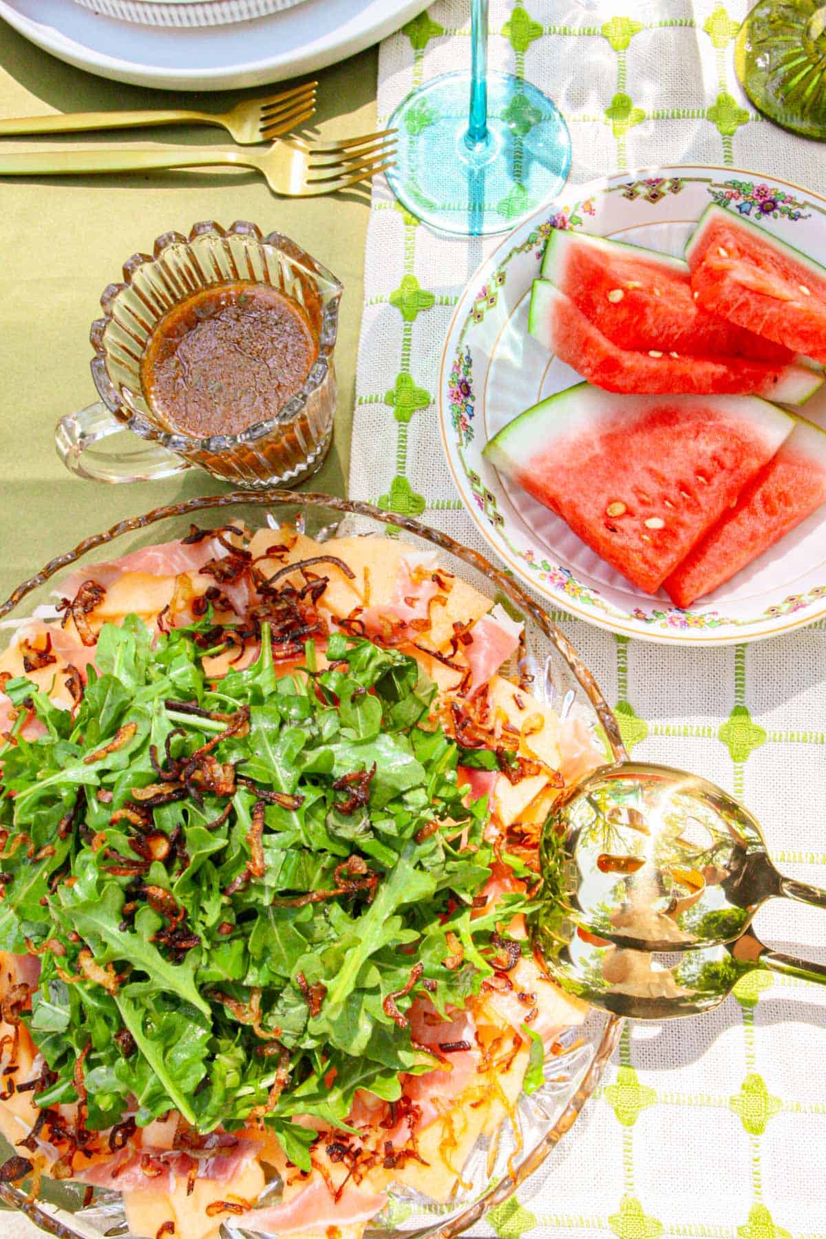 Cantaloupe Prosciutto Salad on a table with fruit