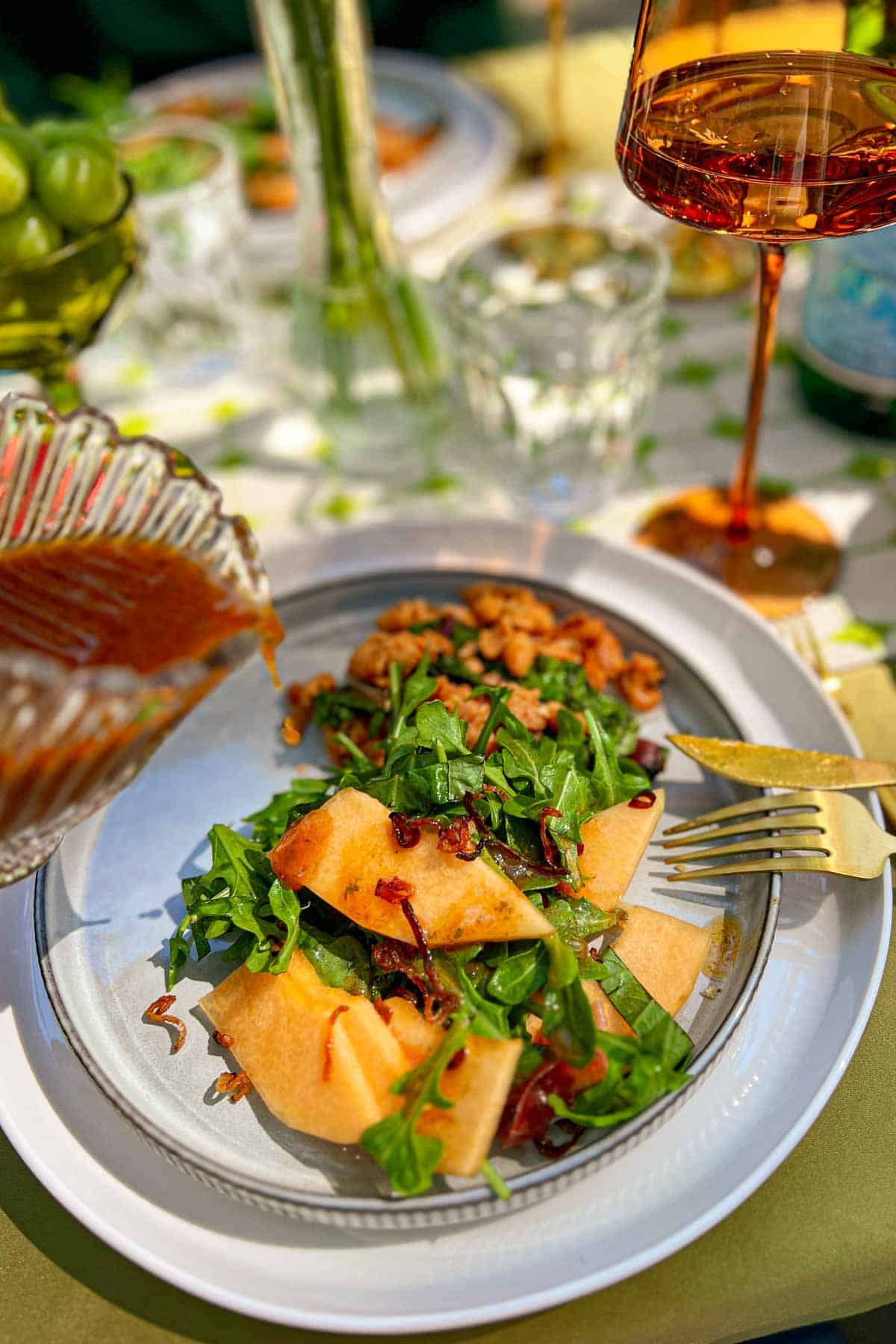 Cantaloupe Prosciutto Salad on a table with fruit