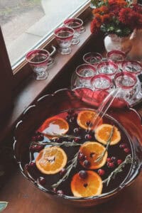 a punch bowl and glasses
