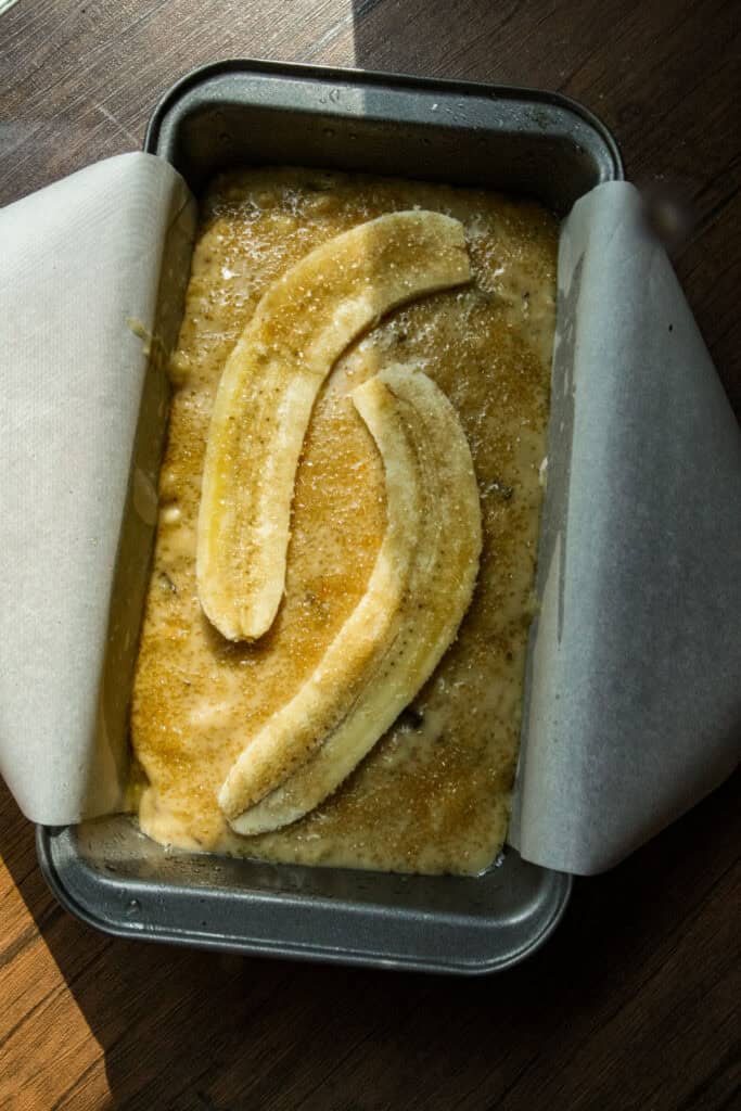 banana bread batter in a baking pan