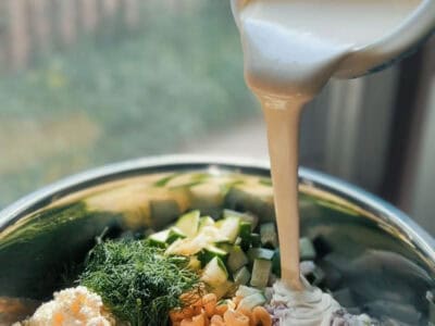 a bowl of pasta salad with dressing
